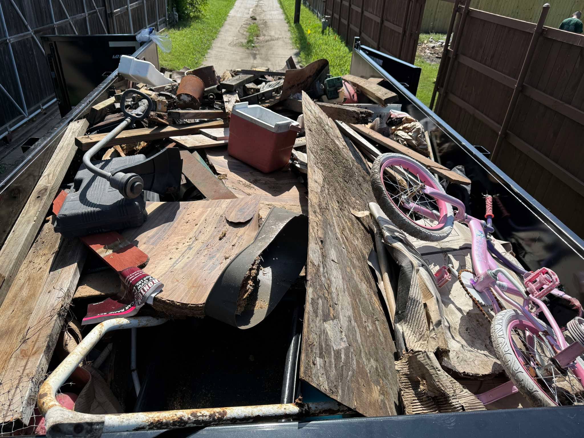 Dump trailer filled with junk from a property cleanout